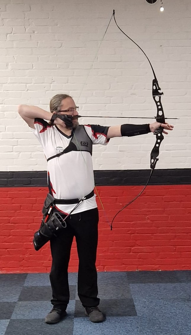 Picture of me holding my bow at the archery club